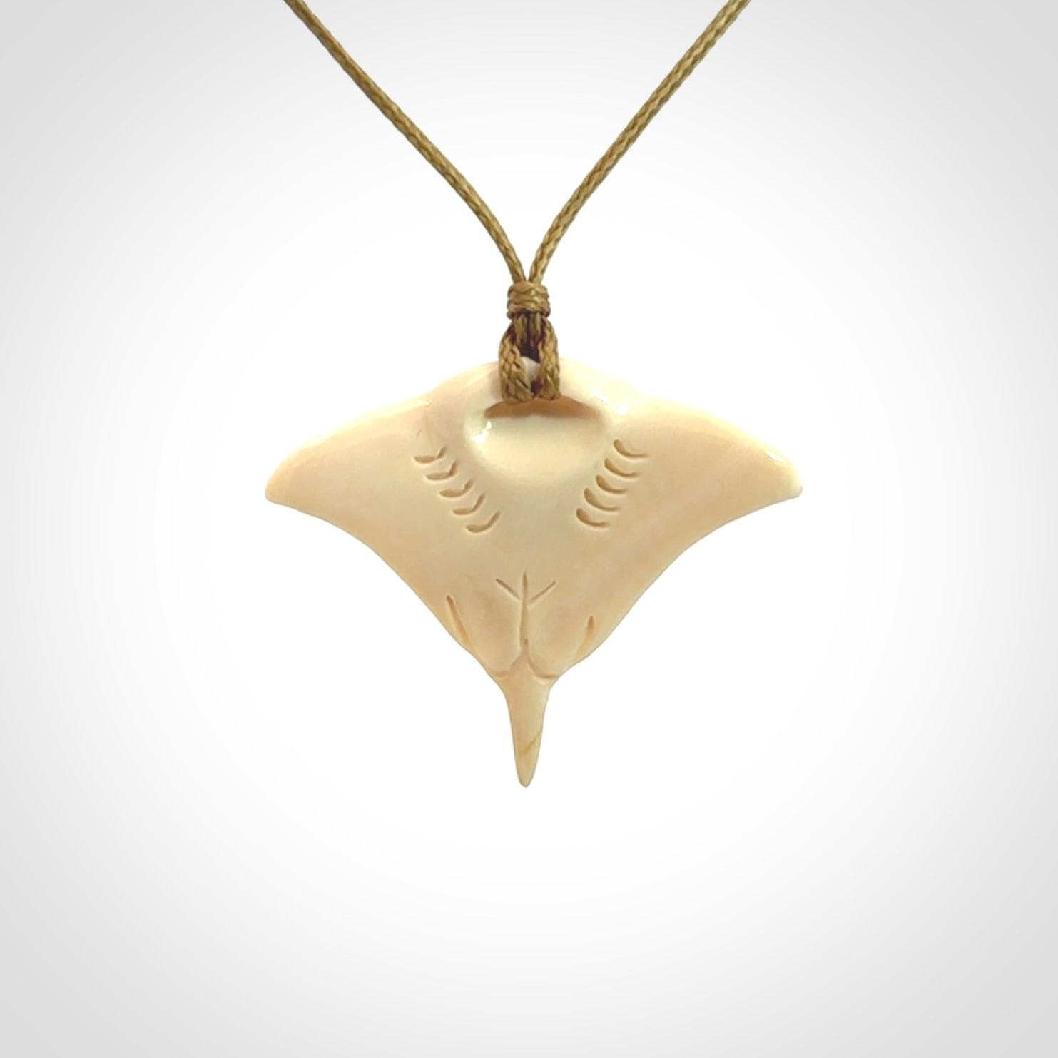Woolly mammoth tusk manta ray pendant. Hand carved Mammoth Tusk manta ray pendant. Provided with adjustable cord.