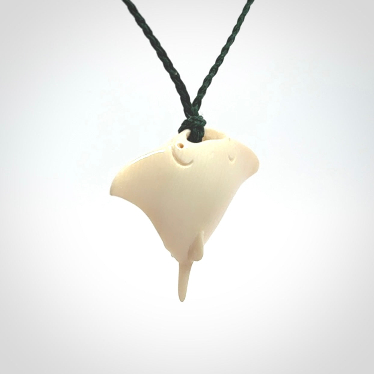 Woolly mammoth tusk manta ray pendant. Hand carved Mammoth Tusk manta ray pendant. Provided with adjustable cord.