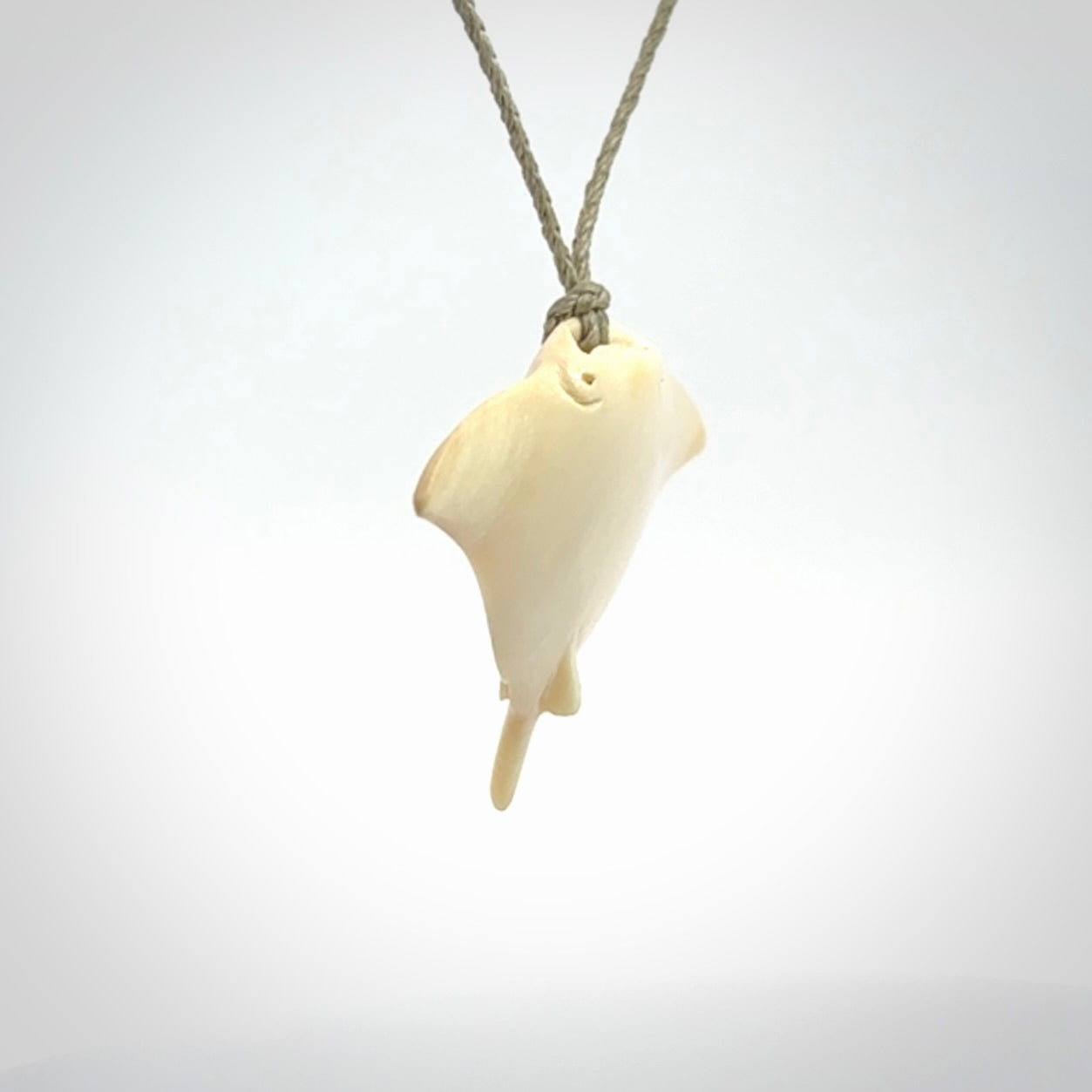 Woolly mammoth tusk manta ray pendant. Hand carved Mammoth Tusk manta ray pendant. Provided with adjustable cord.