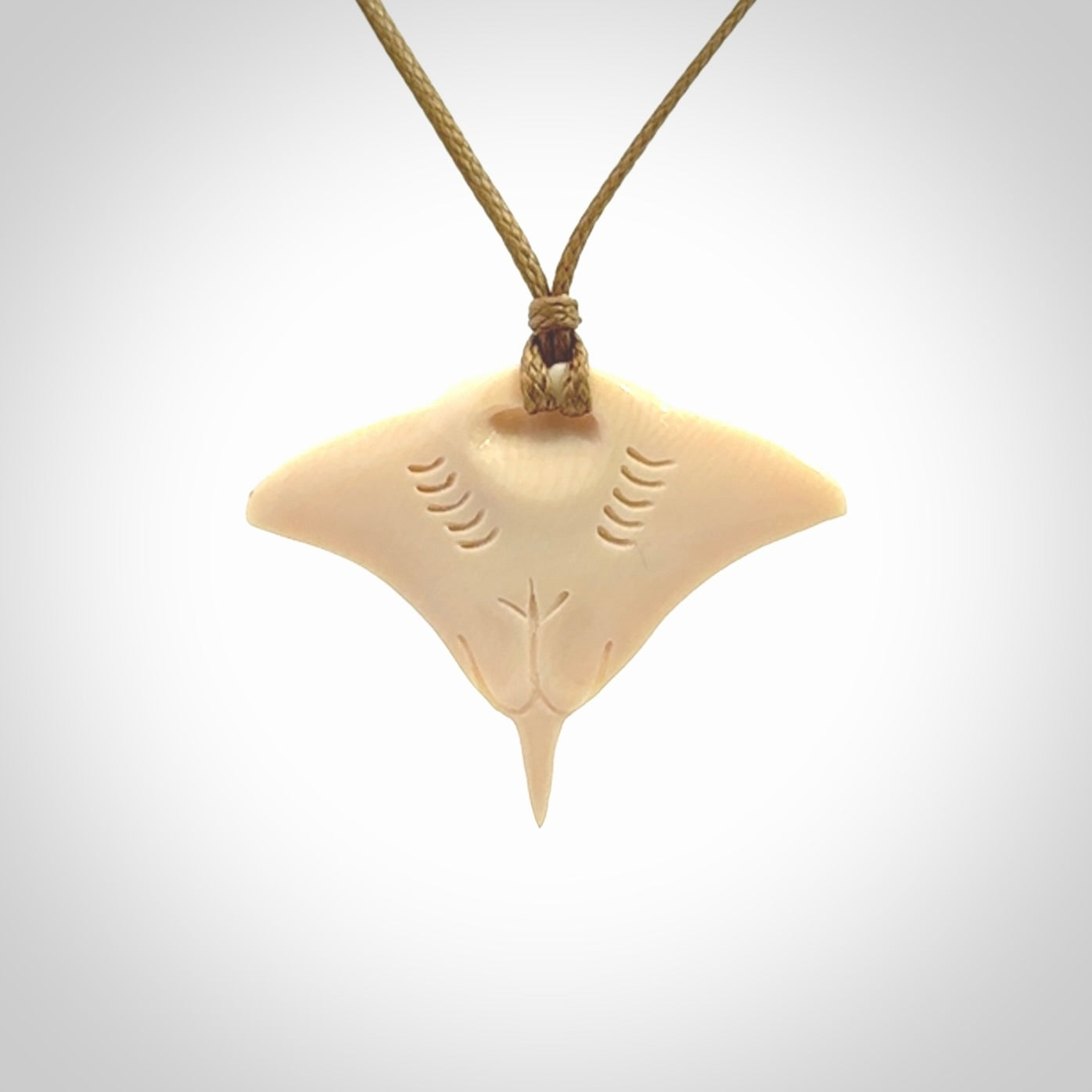 Woolly mammoth tusk manta ray pendant. Hand carved Mammoth Tusk manta ray pendant. Provided with adjustable cord.
