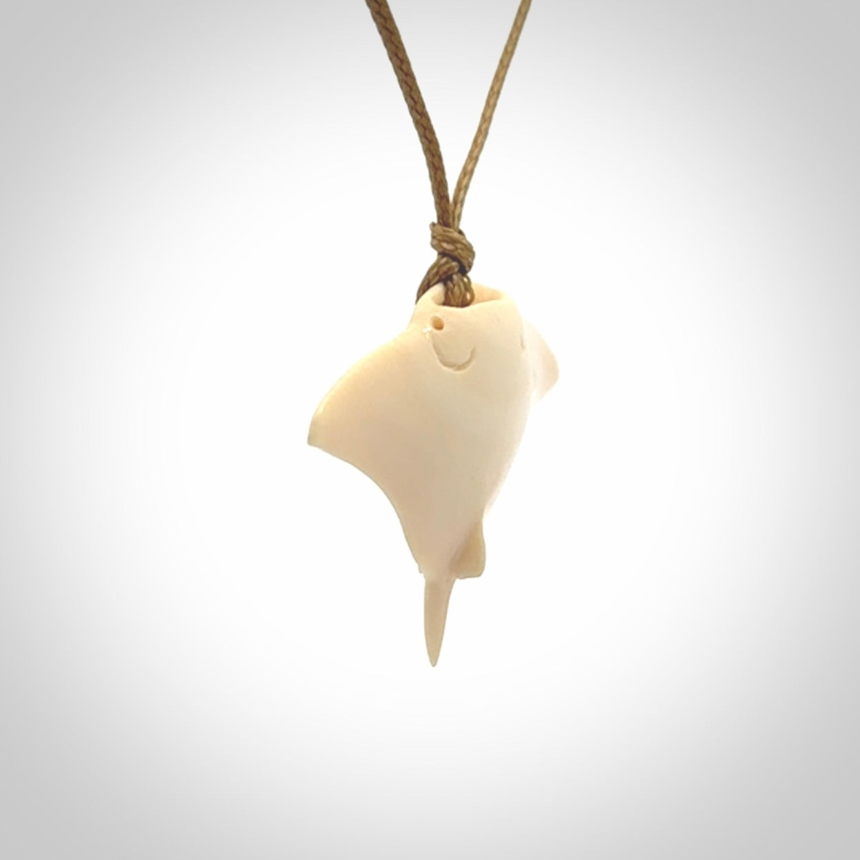 Woolly mammoth tusk manta ray pendant. Hand carved Mammoth Tusk manta ray pendant. Provided with adjustable cord.