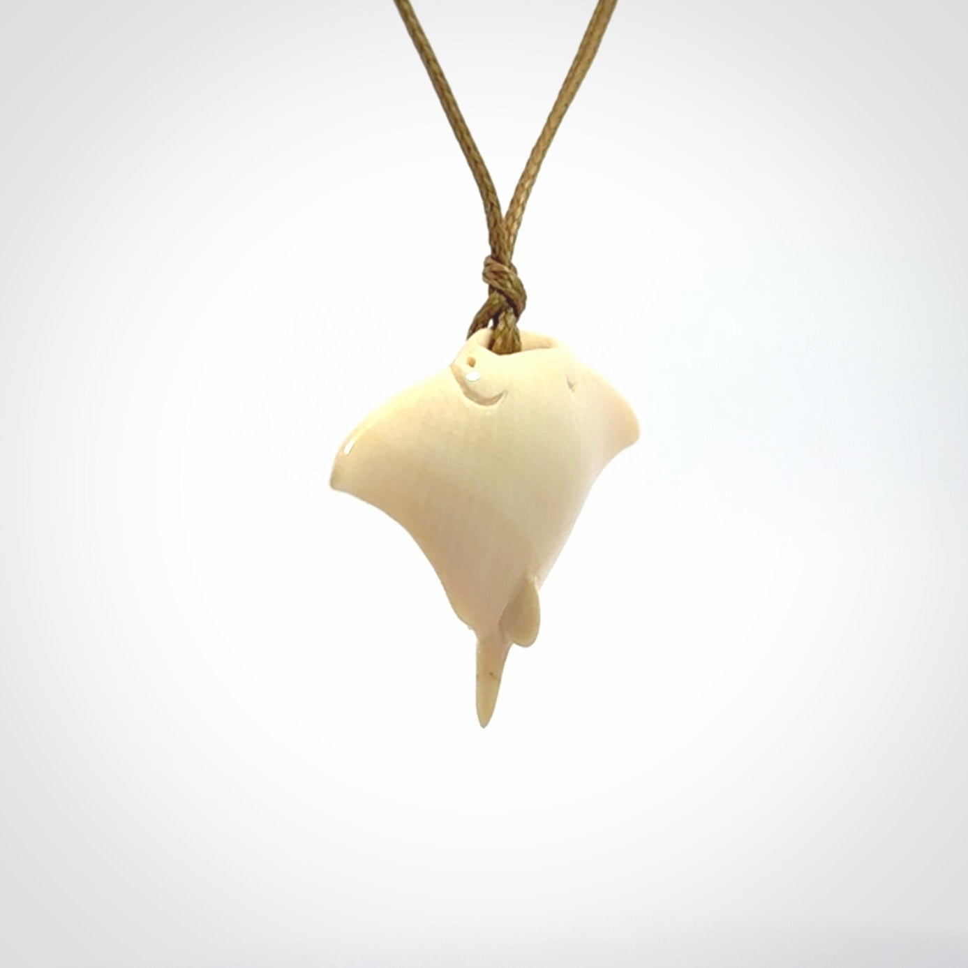 Woolly mammoth tusk manta ray pendant. Hand carved Mammoth Tusk manta ray pendant. Provided with adjustable cord.