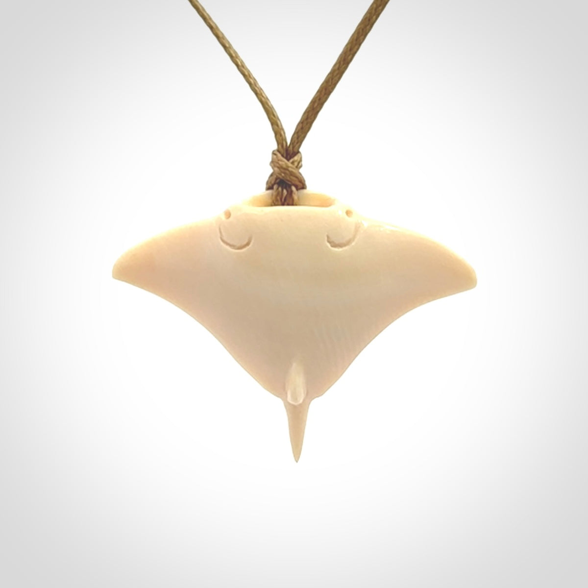 Woolly mammoth tusk manta ray pendant. Hand carved Mammoth Tusk manta ray pendant. Provided with adjustable cord.