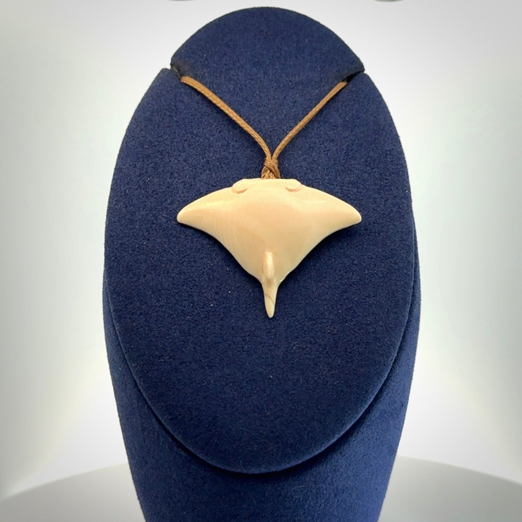 Woolly mammoth tusk manta ray pendant. Hand carved Mammoth Tusk manta ray pendant. Provided with adjustable cord.