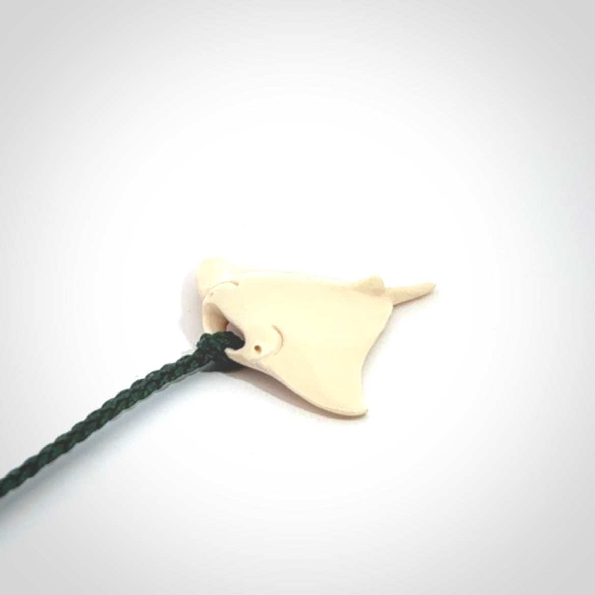 Woolly mammoth tusk manta ray pendant. Hand carved Mammoth Tusk manta ray pendant. Provided with adjustable cord.