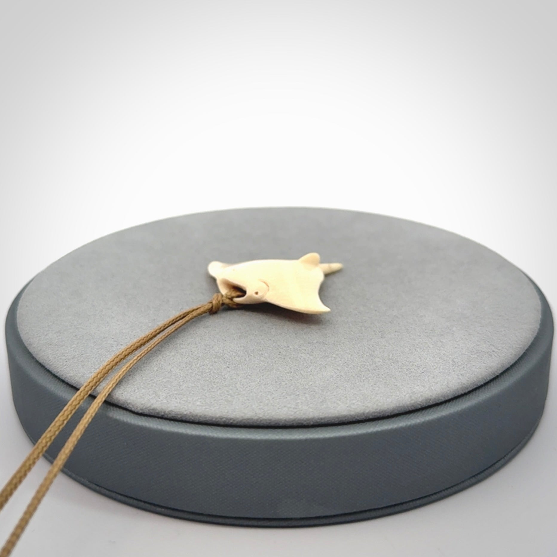 Woolly mammoth tusk manta ray pendant. Hand carved Mammoth Tusk manta ray pendant. Provided with adjustable cord.