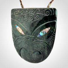 Hand carved New Zealand Jade wheku pendant with paua shell eyes