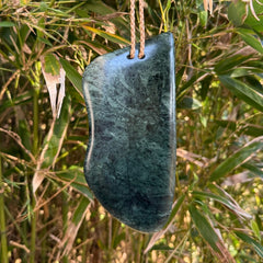 This is a large hand carved New Zealand Jade wheku pendant. It is made from New Zealand Jade and Paua shell.