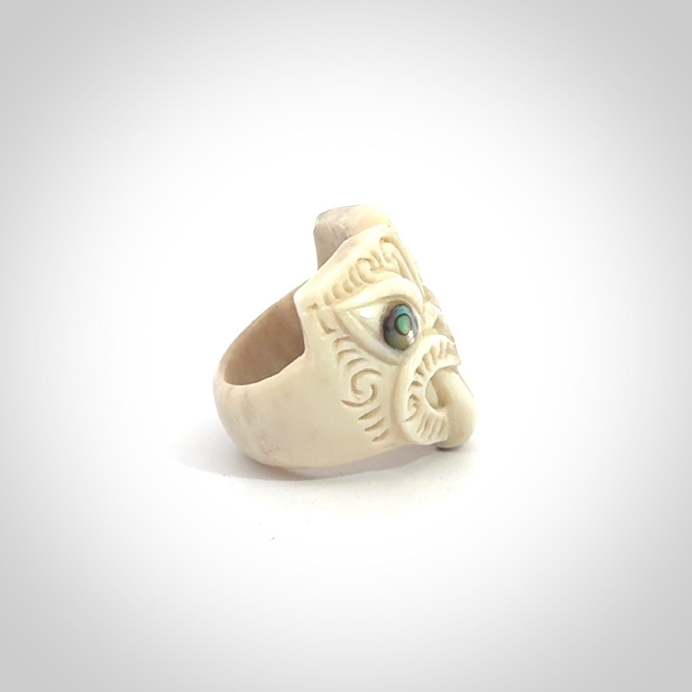 Hand carved deer antler wheku rings with paua shell eyes.