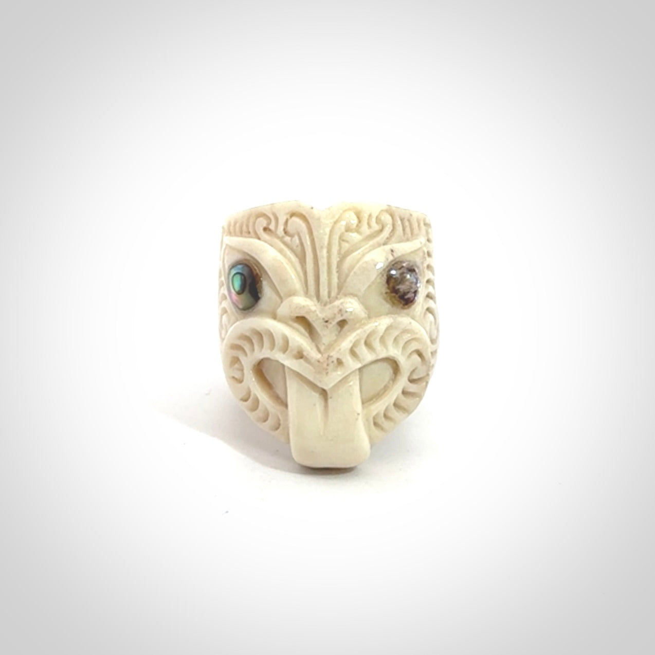 Hand carved deer antler wheku rings with paua shell eyes.