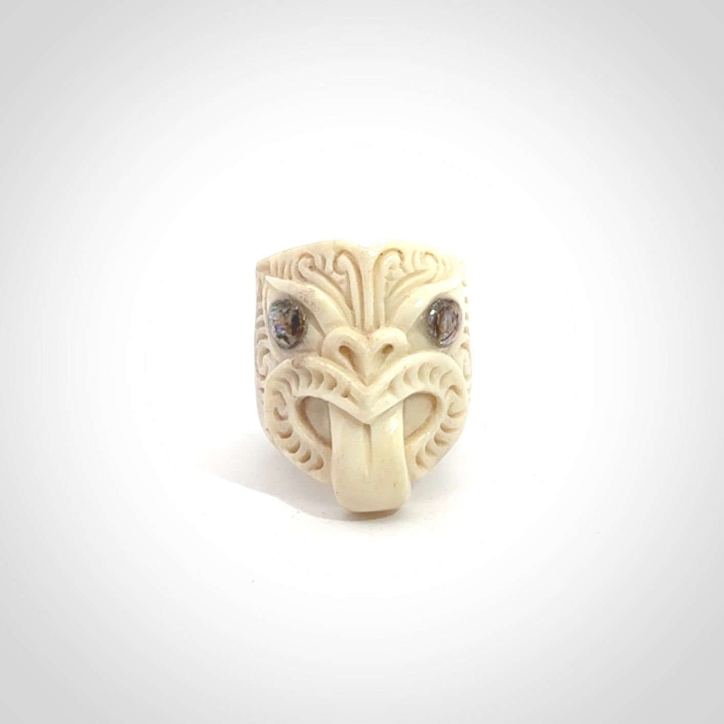 Hand carved deer antler wheku rings with paua shell eyes.