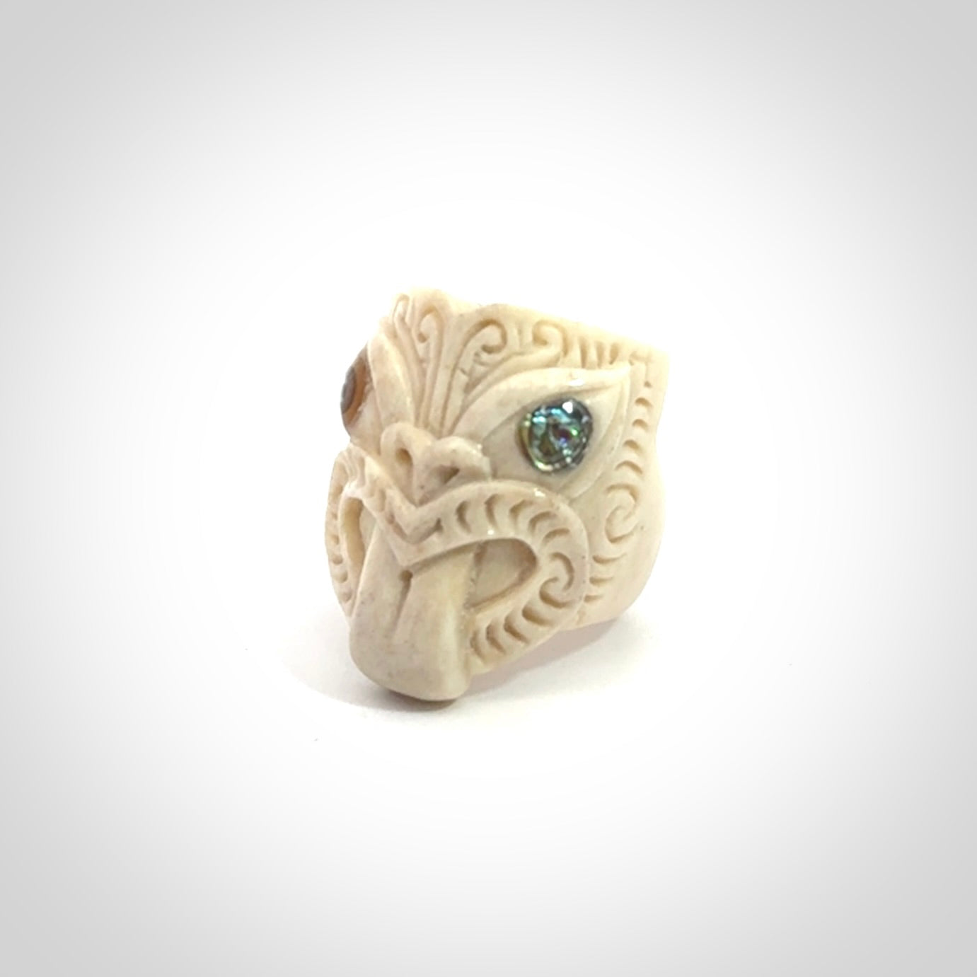 Hand carved deer antler wheku rings with paua shell eyes.