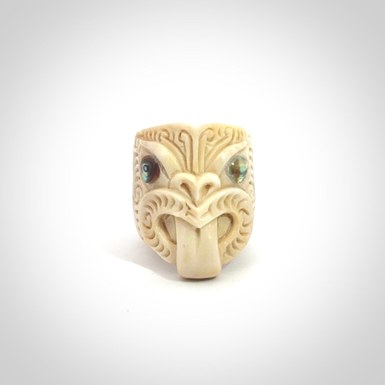 Hand carved deer antler wheku rings with paua shell eyes.