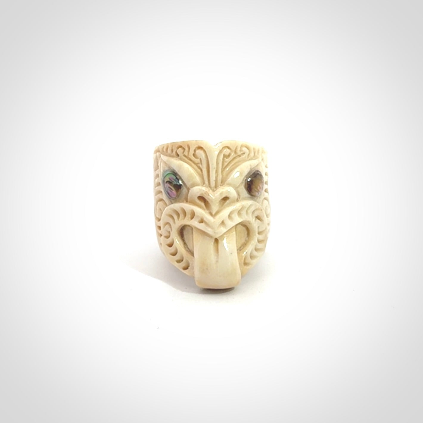 Hand carved deer antler wheku rings with paua shell eyes.