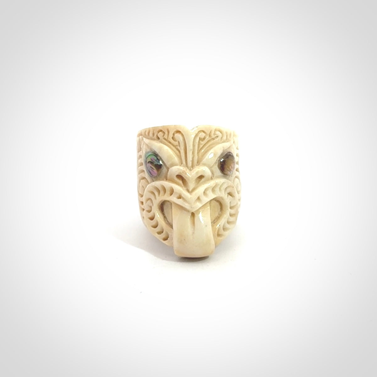 Hand carved deer antler wheku rings with paua shell eyes.