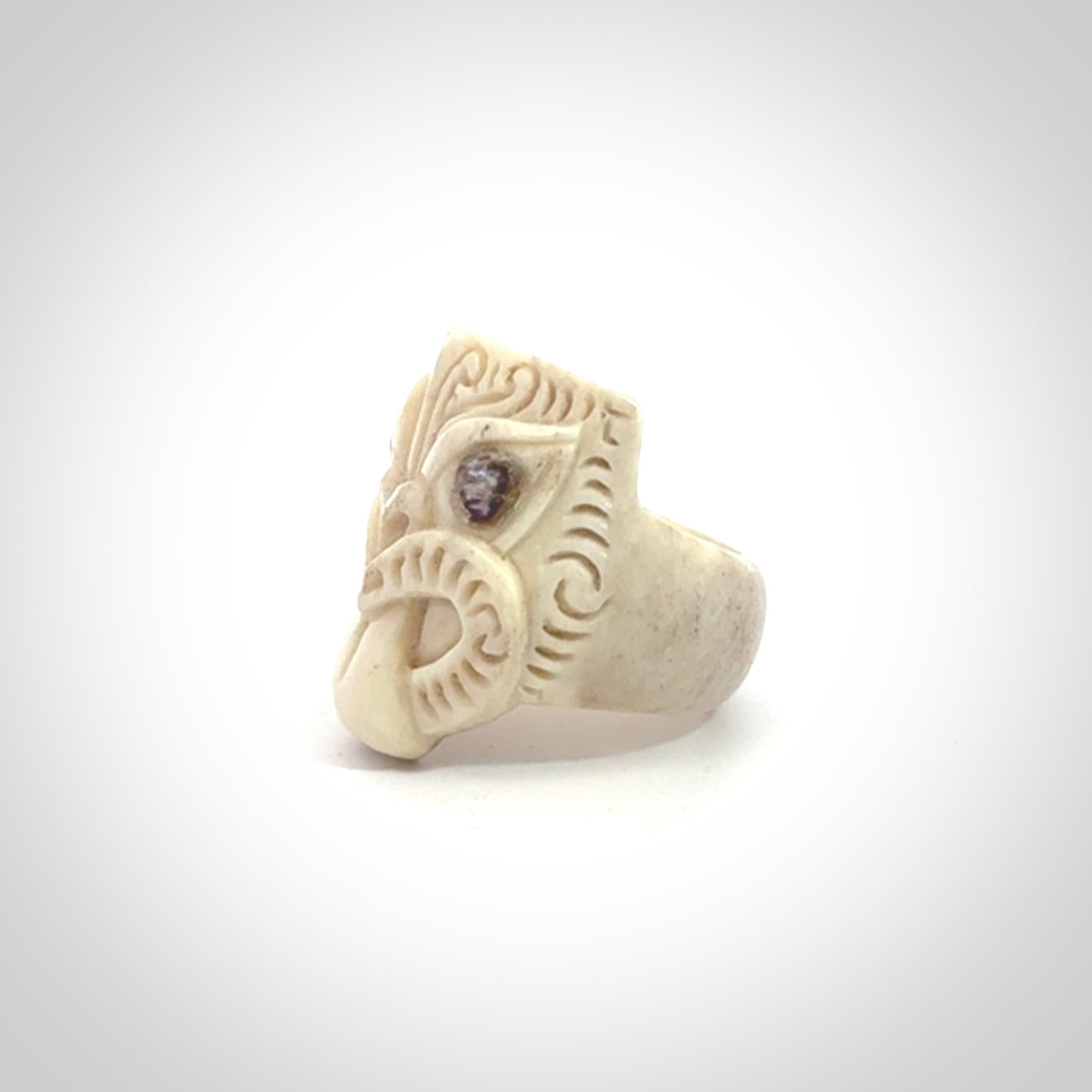 Hand carved deer antler wheku rings with paua shell eyes.