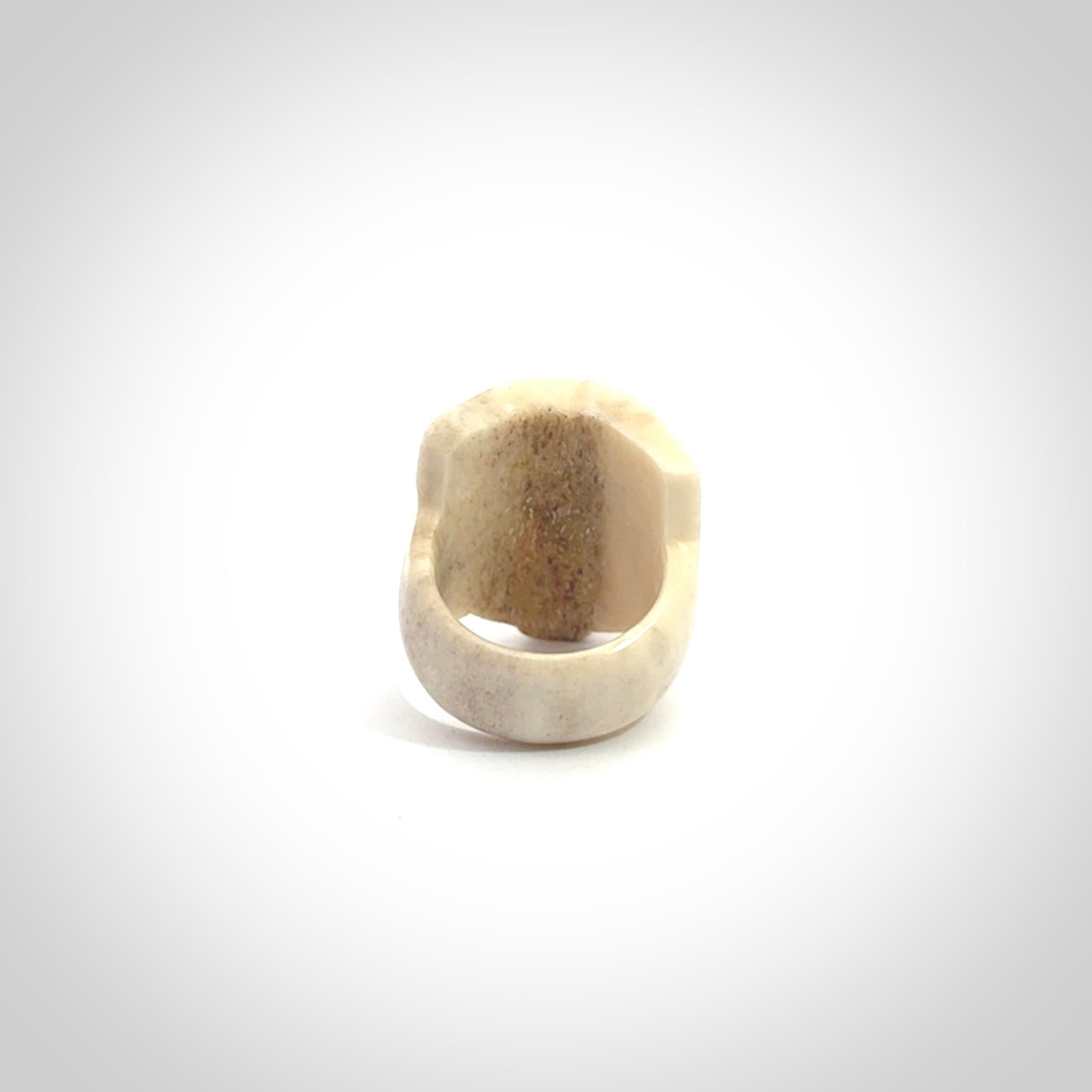 Hand carved deer antler wheku rings with paua shell eyes.