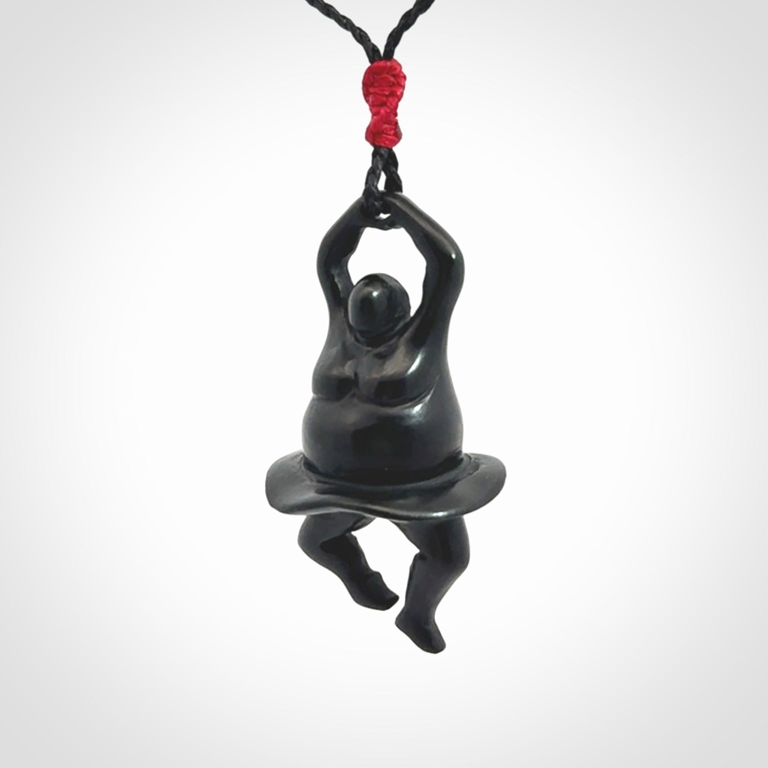Hand carved Black jade ballet dancer pendant. Hand carved by NZ Pacific. Black Jade jewellery for sale online. Ballerina pendant that is provided on a black adjustable cord and packaged in a woven kete pouch.