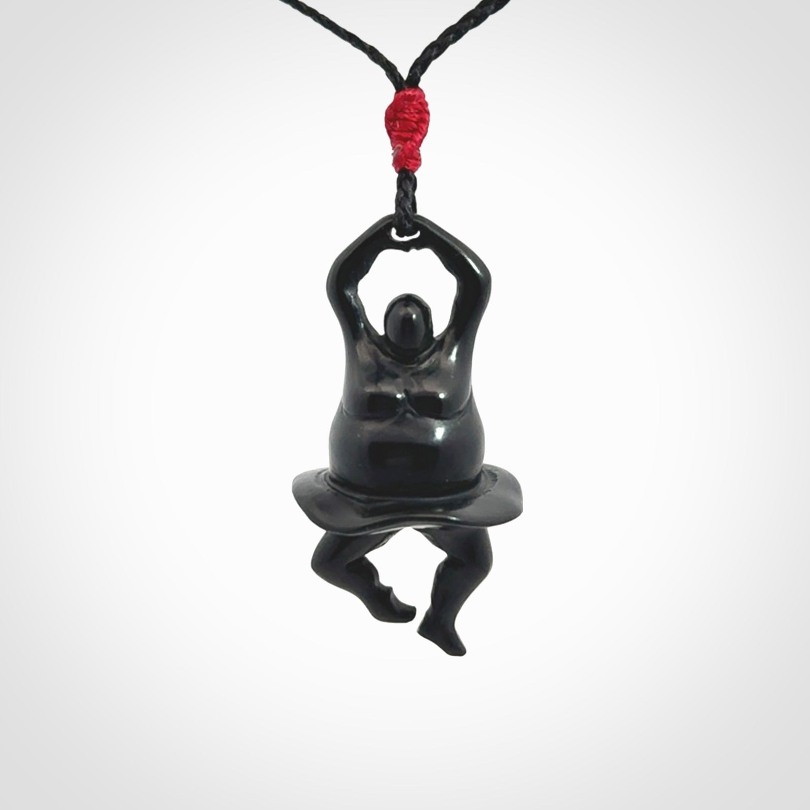 Hand carved Black jade ballet dancer pendant. Hand carved by NZ Pacific. Black Jade jewellery for sale online. Ballerina pendant that is provided on a black adjustable cord and packaged in a woven kete pouch.