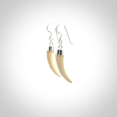 Hand made mammoth tusk drop earrings. Made by NZ Pacific - handmade jewellery for sale online. Woolly Mammoth Tusk fang style earrings, packaged in a woven kete pouch.