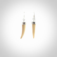 Hand made mammoth tusk drop earrings. Made by NZ Pacific - handmade jewellery for sale online. Woolly Mammoth Tusk fang style earrings, packaged in a woven kete pouch.