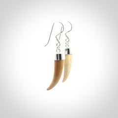 Hand made mammoth tusk drop earrings. Made by NZ Pacific - handmade jewellery for sale online. Woolly Mammoth Tusk fang style earrings, packaged in a woven kete pouch.