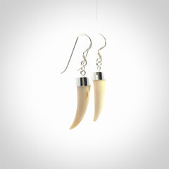 Hand made mammoth tusk drop earrings. Made by NZ Pacific - handmade jewellery for sale online. Woolly Mammoth Tusk fang style earrings, packaged in a woven kete pouch.