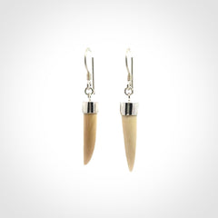Hand made mammoth tusk drop earrings. Made by NZ Pacific - handmade jewellery for sale online. Woolly Mammoth Tusk fang style earrings, packaged in a woven kete pouch.