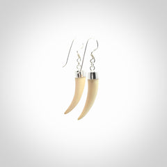 Hand made mammoth tusk drop earrings. Made by NZ Pacific - handmade jewellery for sale online. Woolly Mammoth Tusk fang style earrings, packaged in a woven kete pouch.