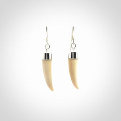 Hand made mammoth tusk drop earrings. Made by NZ Pacific - handmade jewellery for sale online. Woolly Mammoth Tusk fang style earrings, packaged in a woven kete pouch.