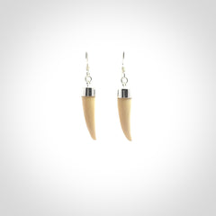 Hand made mammoth tusk drop earrings. Made by NZ Pacific - handmade jewellery for sale online. Woolly Mammoth Tusk fang style earrings, packaged in a woven kete pouch.