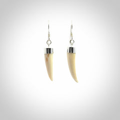 Hand made mammoth tusk drop earrings. Made by NZ Pacific - handmade jewellery for sale online. Woolly Mammoth Tusk fang style earrings, packaged in a woven kete pouch.