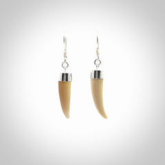 Hand made mammoth tusk drop earrings. Made by NZ Pacific - handmade jewellery for sale online. Woolly Mammoth Tusk fang style earrings, packaged in a woven kete pouch.