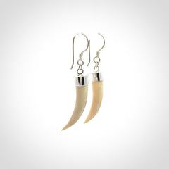 Hand made mammoth tusk drop earrings. Made by NZ Pacific - handmade jewellery for sale online. Woolly Mammoth Tusk fang style earrings, packaged in a woven kete pouch.