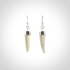 Hand made mammoth tusk drop earrings. Made by NZ Pacific - handmade jewellery for sale online. Woolly Mammoth Tusk fang style earrings, packaged in a woven kete pouch.