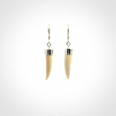 Hand made mammoth tusk drop earrings. Made by NZ Pacific - handmade jewellery for sale online. Woolly Mammoth Tusk fang style earrings, packaged in a woven kete pouch.