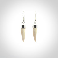 Hand made mammoth tusk drop earrings. Made by NZ Pacific - handmade jewellery for sale online. Woolly Mammoth Tusk fang style earrings, packaged in a woven kete pouch.