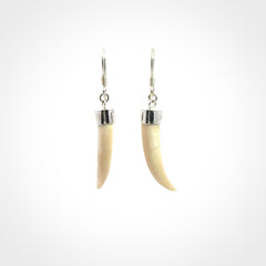 Hand made mammoth tusk drop earrings. Made by NZ Pacific - handmade jewellery for sale online. Woolly Mammoth Tusk fang style earrings, packaged in a woven kete pouch.