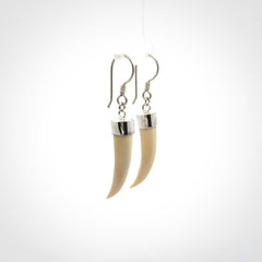 Hand made mammoth tusk drop earrings. Made by NZ Pacific - handmade jewellery for sale online. Woolly Mammoth Tusk fang style earrings, packaged in a woven kete pouch.