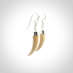 Hand made mammoth tusk drop earrings. Made by NZ Pacific - handmade jewellery for sale online. Woolly Mammoth Tusk fang style earrings, packaged in a woven kete pouch.