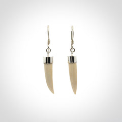 Hand made mammoth tusk drop earrings. Made by NZ Pacific - handmade jewellery for sale online. Woolly Mammoth Tusk fang style earrings, packaged in a woven kete pouch.