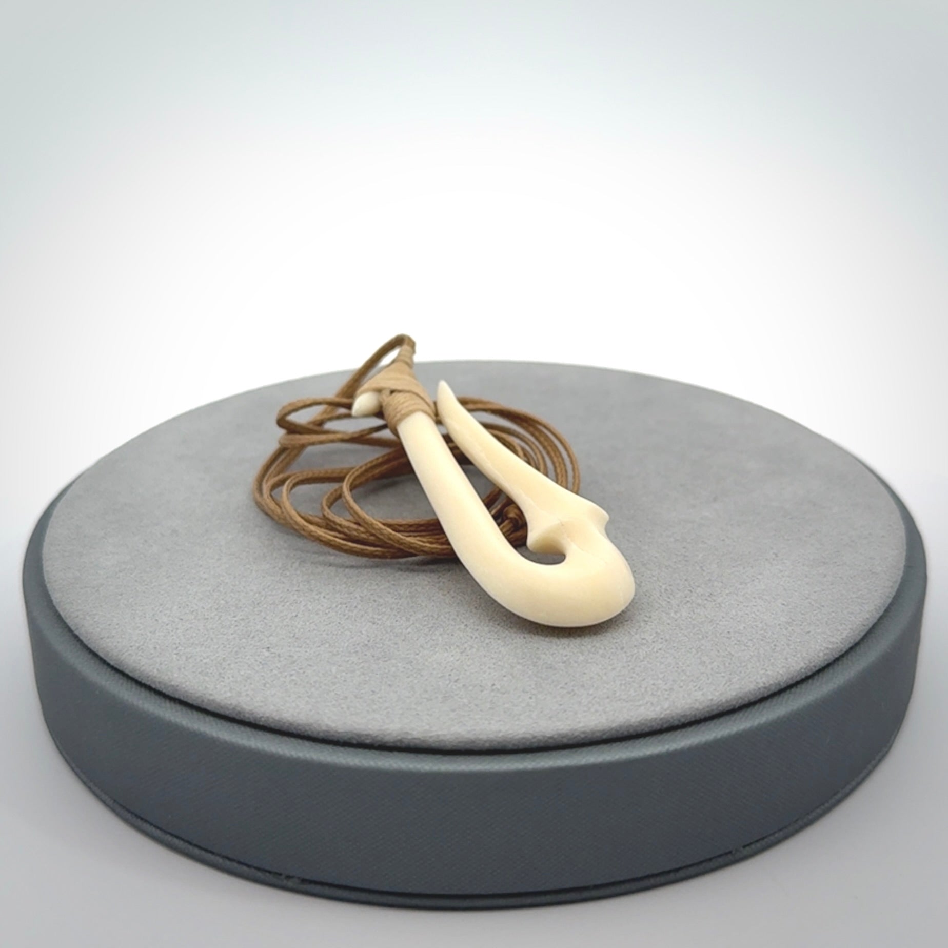 Hand made bone hook, or matau, pendant. The cord can be adjusted. It is a large sized pendant and is well carved. A beautiful piece of art to wear, hand carved jewellery. Delivered in woven kete pouch with express courier.
