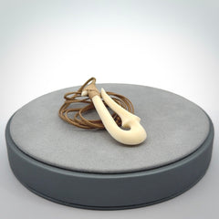 Hand made bone hook, or matau, pendant. The cord can be adjusted. It is a large sized pendant and is well carved. A beautiful piece of art to wear, hand carved jewellery. Delivered in woven kete pouch with express courier.