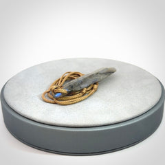 This is a hand carved feather pendant made from Labradorite stone.