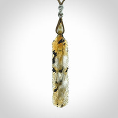 This is a hand carved feather pendant made from Labradorite stone.
