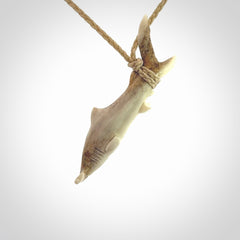 Winghead or hammerhead shark pendant. Hand carved from deer antler by NZ Pacific. Hand carved bone jewellery for sale online.