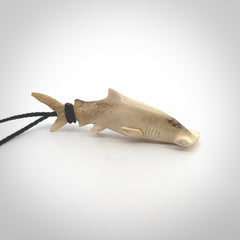 Winghead or hammerhead shark pendant. Hand carved from deer antler by NZ Pacific. Hand carved bone jewellery for sale online.