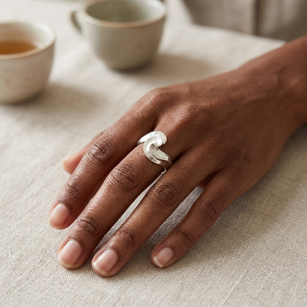 Hand wearing sterling silver ring