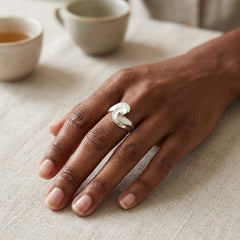Hand wearing sterling silver ring
