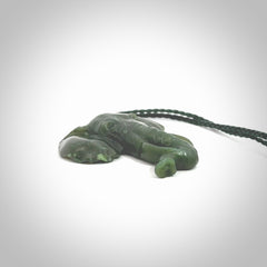 This is a hand made elephant pendant. Carved in a beautiful darker green piece of Aceh jade. The cord is hand-plaited in an green colour and is length adjustable. Provided in a woven kete pouch and delivered with express courier.